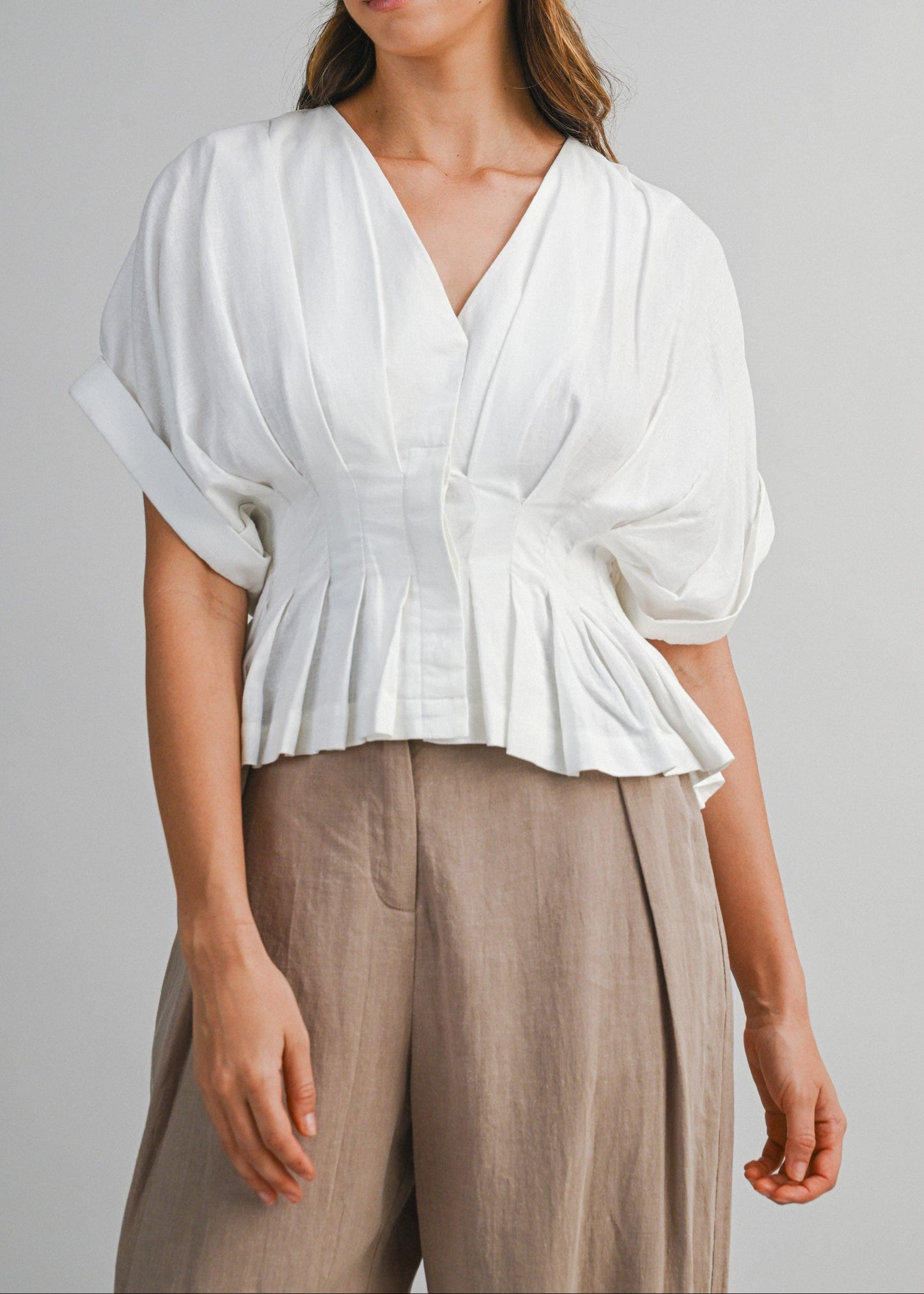 IVA PLEATED PEPLUM TOP