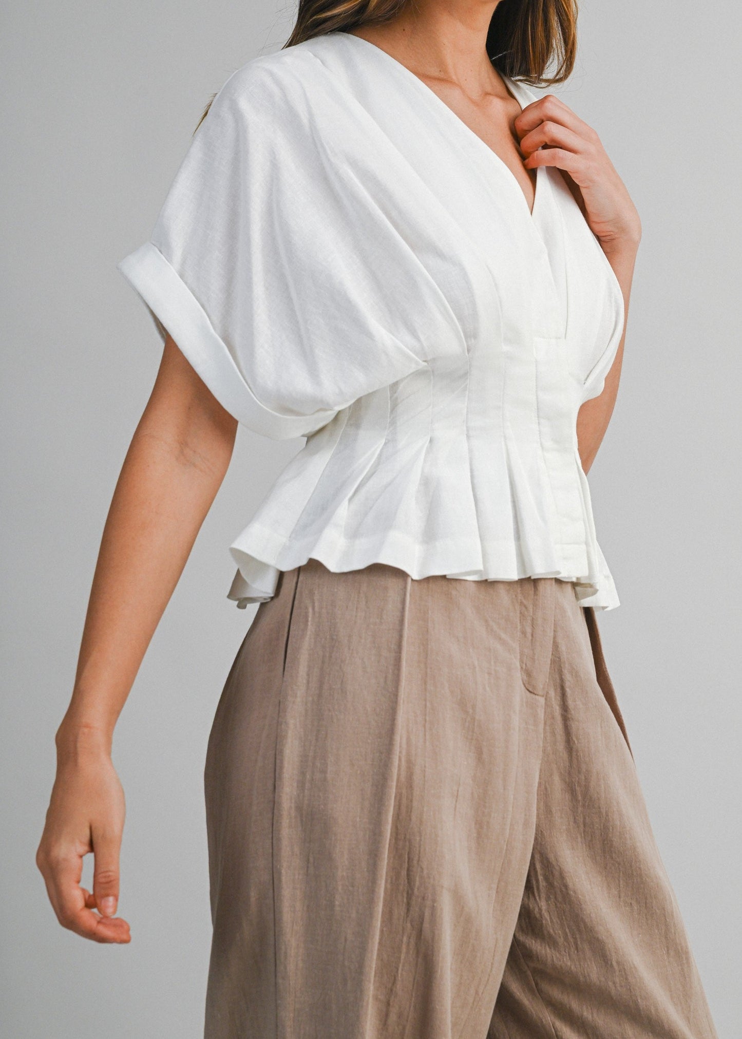 IVA PLEATED PEPLUM TOP
