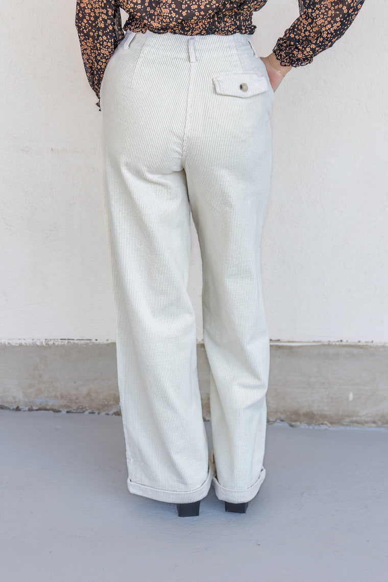 ivory corduroy pants with brown buttons